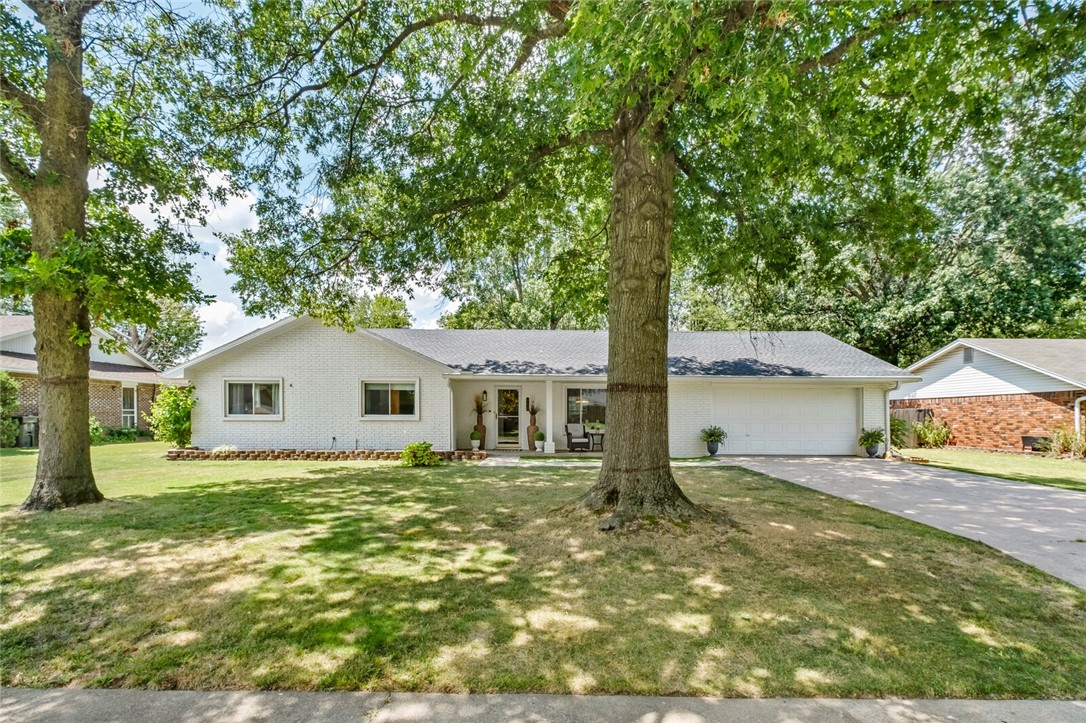 Don't miss your chance to see this amazingly renovated ranch style home in an amazing location. Beautiful mature trees on a flat lot make this a picturesque setting. Quiet dead end street makes traffic almost nonexistent. Walk into an open floor plan with the dining room flowing into the living room highlighted by a natural stone fireplace. Kitchen is set up to easily entertain all your guests or family. Powder bath and laundry off the back of the kitchen provide convenience. The heated/cooled sunroom off the living room provide another space to relax and enjoy the tree covered backyard. 3 bedrooms on the other end of the house allow for privacy from the main living space. Almost everything has been updated making this house very comfortable. Come take a look and decide for yourself.