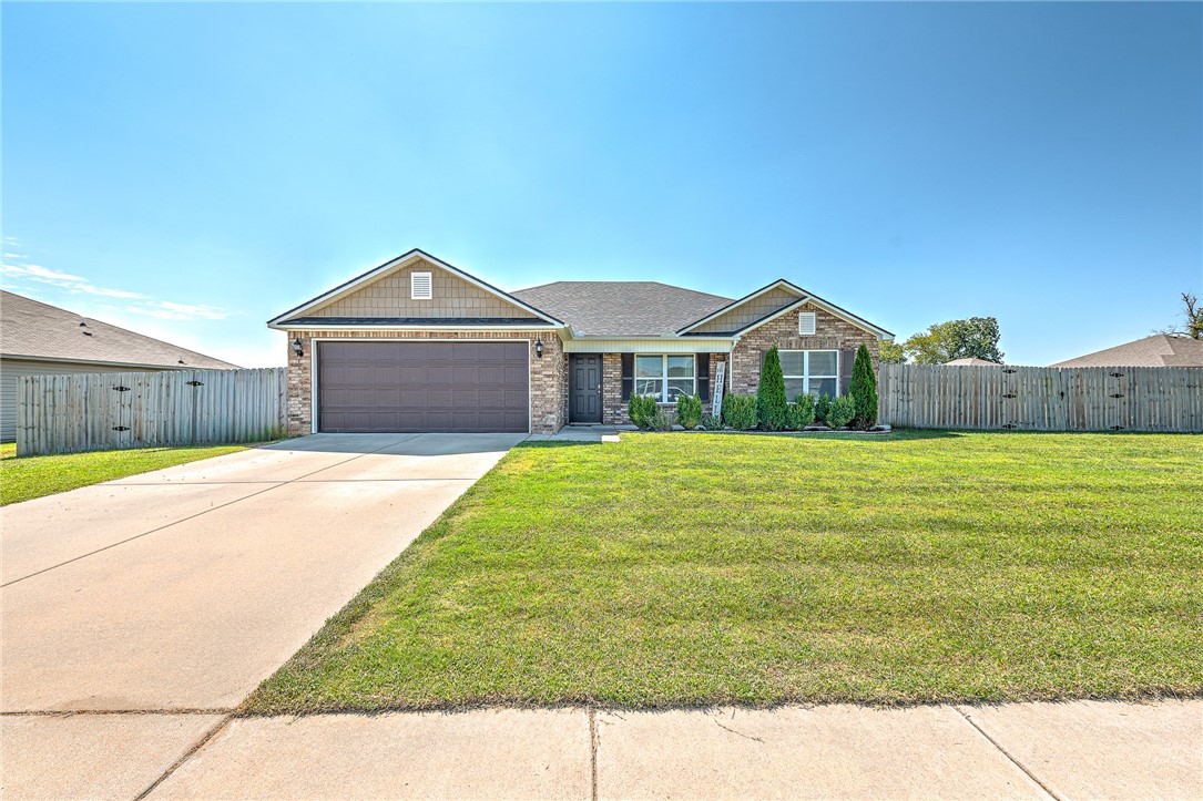 Welcome to 825 NW 67th Street in Bentonville! This immaculately cared-for 3-bedroom, 2-bath home sits on a spacious corner lot with a fully fenced backyard and wood privacy fence, perfect for entertaining, pets, or relaxing outdoors. Inside, you’ll love the open layout with durable ceramic tile floors, a functional kitchen, and a comfortable primary suite. Natural light flows throughout, creating a warm and inviting feel. Ideally located just minutes from XNA Airport, this home offers convenience for frequent travelers and professionals while still being close to Bentonville’s shopping, dining, and entertainment. Outdoor lovers will enjoy local trails, parks, and all that Northwest Arkansas has to offer. Whether you’re relocating, buying your first home, or looking for a well-maintained property in a quiet setting with great accessibility, this Bentonville home is a fantastic opportunity. Don’t miss it!