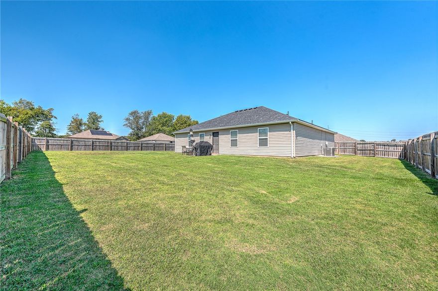 Welcome to 825 NW 67th Street in Bentonville! This immaculately cared-for 3-bedroom, 2-bath home sits on a spacious corner lot with a fully fenced backyard and wood privacy fence, perfect for entertaining, pets, or relaxing outdoors. Inside, you’ll love the open layout with durable ceramic tile floors, a functional kitchen, and a comfortable primary suite. Natural light flows throughout, creating a warm and inviting feel. Ideally located just minutes from XNA Airport, this home offers convenience for frequent travelers and professionals while still being close to Bentonville’s shopping, dining, and entertainment.  Outdoor lovers will enjoy local trails, parks, and all that Northwest Arkansas has to offer. Whether you’re relocating, buying your first home, or looking for a well-maintained property in a quiet setting with great accessibility, this Bentonville home is a fantastic opportunity. Don’t miss it!