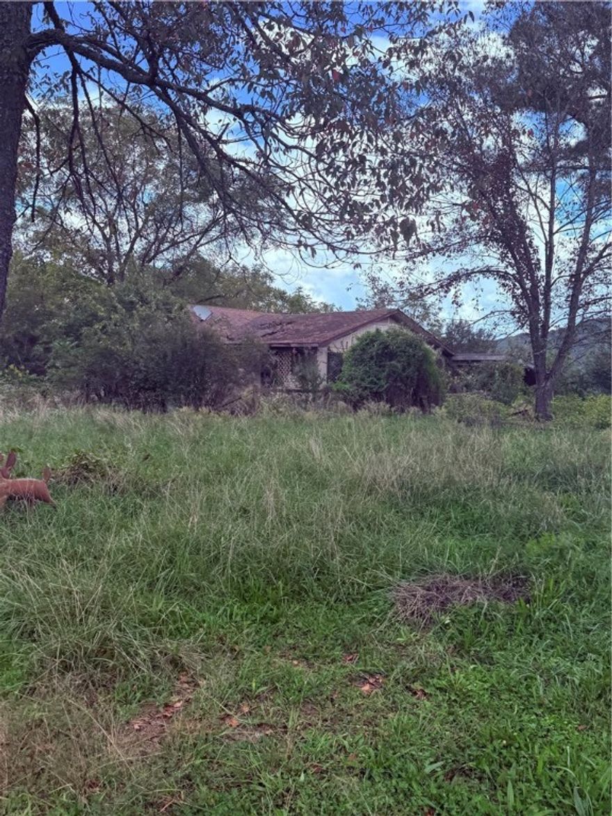 Abandoned and Collapsed home, that is uninhabitable on 1. 54 acres of land on Hwy 16 in Elkins, AR