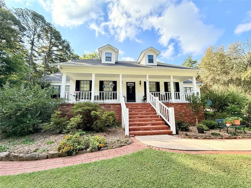 Welcome to this charming 4-bedroom, 2.5-bathroom home nestled in the desirable Hickory Hills Subdivision. Situated on a quiet dead-end road, this 2,324 sq. ft. property offers the perfect blend of comfort and privacy in a friendly neighborhood. Inside, you’ll find a spacious living room with tall ceilings and a cozy fireplace, creating a warm and inviting atmosphere. The split floor plan provides plenty of room for everyone, including a primary suite with an attached full bathroom and walk-in closet. A formal dining area, eat-in kitchen, and 2-car garage add both function and convenience. Step outside to enjoy the beautifully landscaped backyard, complete with walking paths that extend around to the front of the home. The outdoor spaces are ideal for relaxation, entertaining, or simply enjoying the peaceful surroundings. This property offers space, comfort, and curb appeal—a perfect place to call home in Russellville.