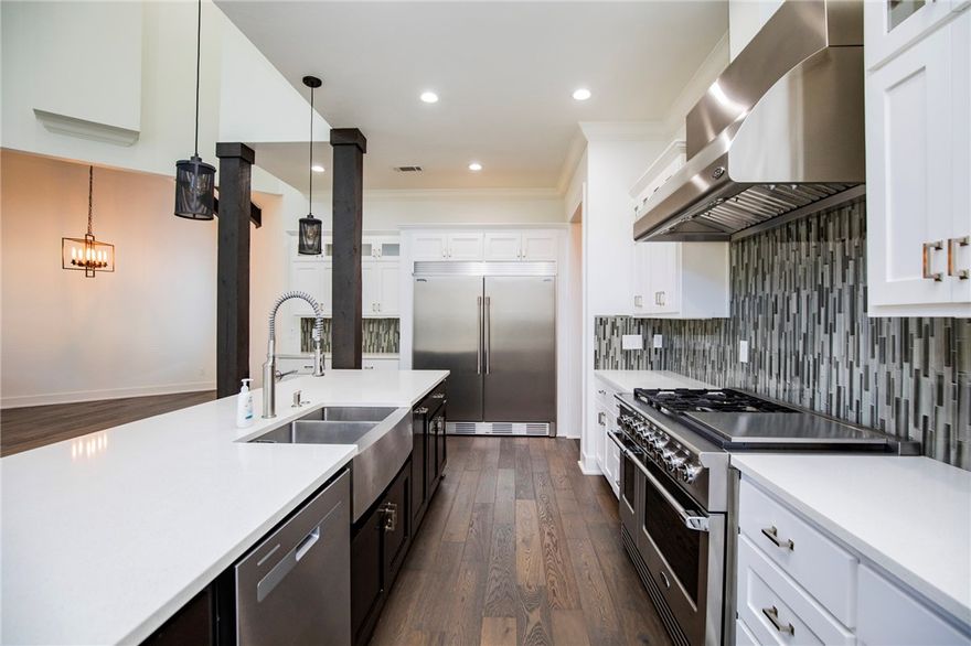 Stunning home in prestigious Pinnacle featuring a modern open floor plan and chef-designed gourmet kitchen with professional Frigidaire built-in refrigerator/freezer and DCS by Fisher & Paykel range and hood. Offering 4 bedrooms plus a bonus room (ideal 5th bedroom or flex space), this home provides exceptional versatility. The main level includes 2 bedrooms, office, dining, oversized laundry, and 2 fireplaces. The primary suite features heated tile shower floors. Hardwood flooring runs throughout the main level, staircase, and upper hall. Upstairs includes 2 bedrooms, bonus/flex room, and abundant storage. Enjoy outdoor living on the covered deck with fireplace and convenient rear gate access. Located in the Bentonville School District near Pinnacle amenities, shopping, dining, and I-49.