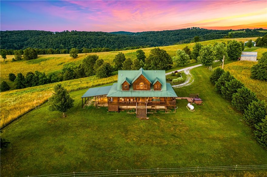 Located just 6 miles from Ponca and the Buffalo National River, this is one of the nicest properties in Newton County AR! This 563 m/l acres offers it all! From the new asphalt driveway leading from a paved highway up to the main lodge with views, mountain top pastures, deep woods with bluffs and creeks to a year-round spring-fed pond that maintains it's level even in drought, you have it all! The beautiful cedar log cabin lodge is a Hostettler masterpiece with custom built solid wood doors, cabinets and cedar accents throughout as well as cedar walls and a cat walk! Pine floors, nice appliances, a master suite with a garden tub of it's own, walk-in closet and it's own sliding doors going to the wrap-around covered veranda. Or enjoy the hot tub under the stars. This comes fully