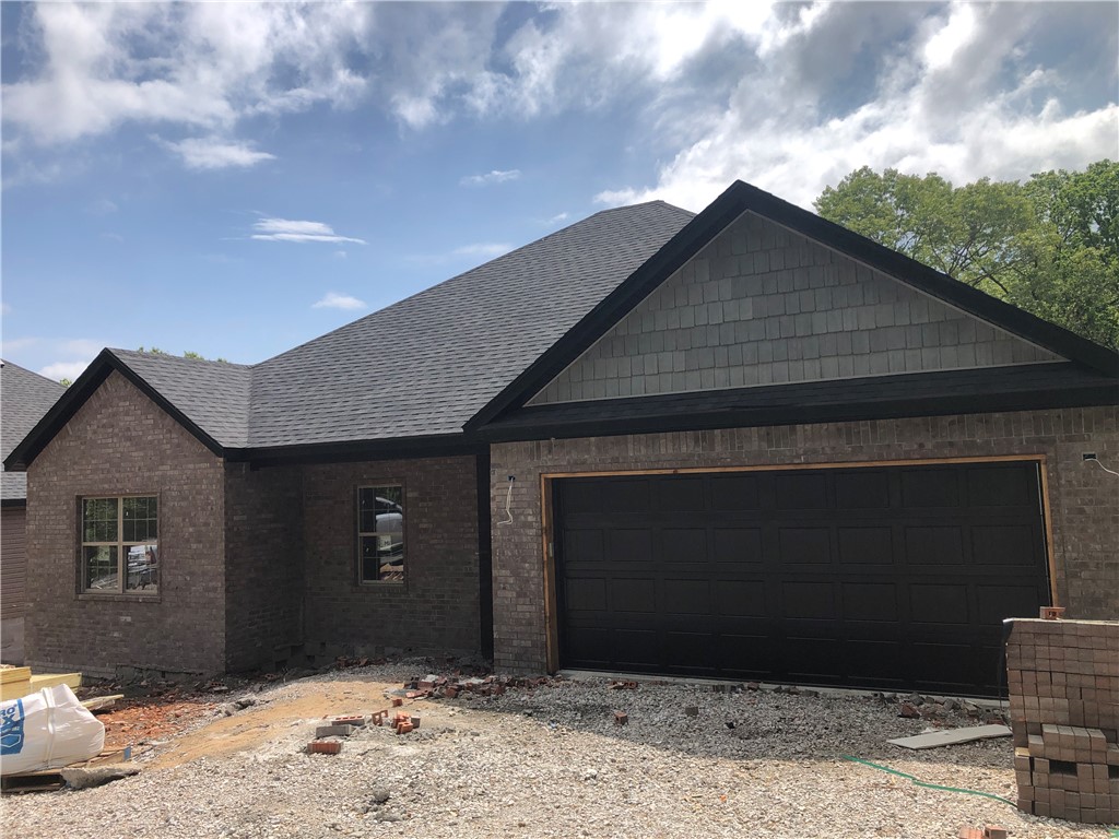 By the bike trails - new construction home in Bella Vista with a usable yard! And there's still time to make some personal finishing choices. Enjoy 9 ft. ceilings and ample natural light, granite counters, stainless appliances, custom tiled showers, a large eat-in kitchen with an open living floorplan, a beautiful large deck and modern touches throughout.