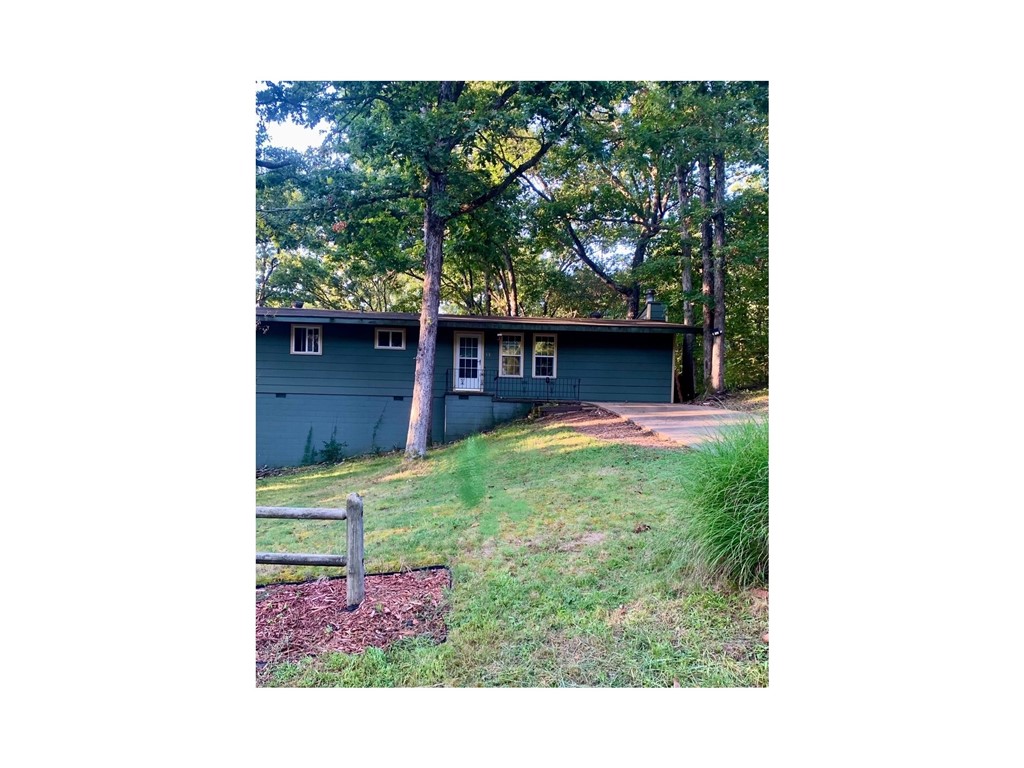 This 2-bedroom, 1-bath home has two lots totalling .75-acre lot at the end of a quiet cul-de-sac, offering privacy and plenty of potential. Just minutes from all the amazing Bella Vista amenities, including trails, lakes, golf, and community centers. You’ll love the location.
The home is being sold as-is and will not qualify for FHA or VA financing, making it a great opportunity for investors or buyers ready to put in some work. HVAC replaced in 2018 and Roof replaced in 2019. Attached workshop has lots of space for all your projects. Recent mold remediation has already been completed, giving you a head start on renovations. With the right vision, this property could become a cozy retreat or an excellent investment!