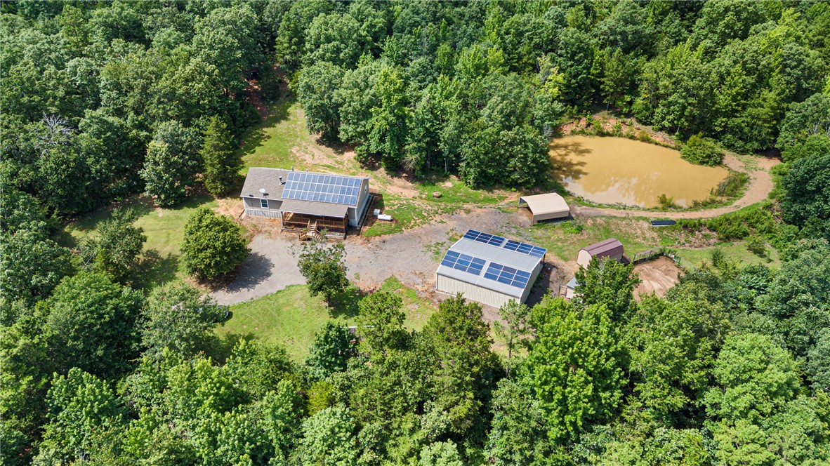Ever wanted to go off-grid, but the hassle setting up solar & water overwhelm you? Check out this Mountain Beauty 2404 Ross Mountain Rd in Lamar, AR (Pope County)! Where it's already done for you. This secluded homestead is fully equipped with a solar power system, backup generator, a storm cellar, and water wellāoffering modern comfort with self-sufficiency. The property includes 37.5 acres, a pond stocked with fish, greenhouse, and a detached, heated/cooled shop with its own solar system (Strong enough to run a welder)!
Outdoor lovers will enjoy being within 15 miles of Lake Dardanelle (fishing/boating), the Ozark National Forest (hiking/hunting/ATV trails), & Big Piney Creek / the Illinois Bayou (kayaking/floating). Or, never leave the property with plenty of Deer & other wild game to hunt!
Whether you want a full-time residence or a weekend retreat, this off-grid gem ready to go! For anything that the mountain can't provide, you're within 17 minutes to Dover & 30 minutes to downtown Russellville.