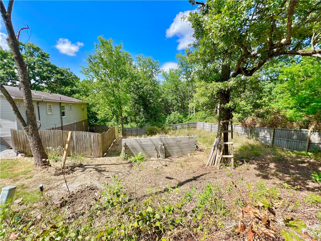 This lot is .44 acres and is only a 6 minute drive to the University, 4 minutes to I49, and 10 minutes to Dickson St. Property has been already been surveyed and split would be finalized at closing. Available to purchase additional .37 acres with duplex; totaling .81 acres - see ML#1312818.