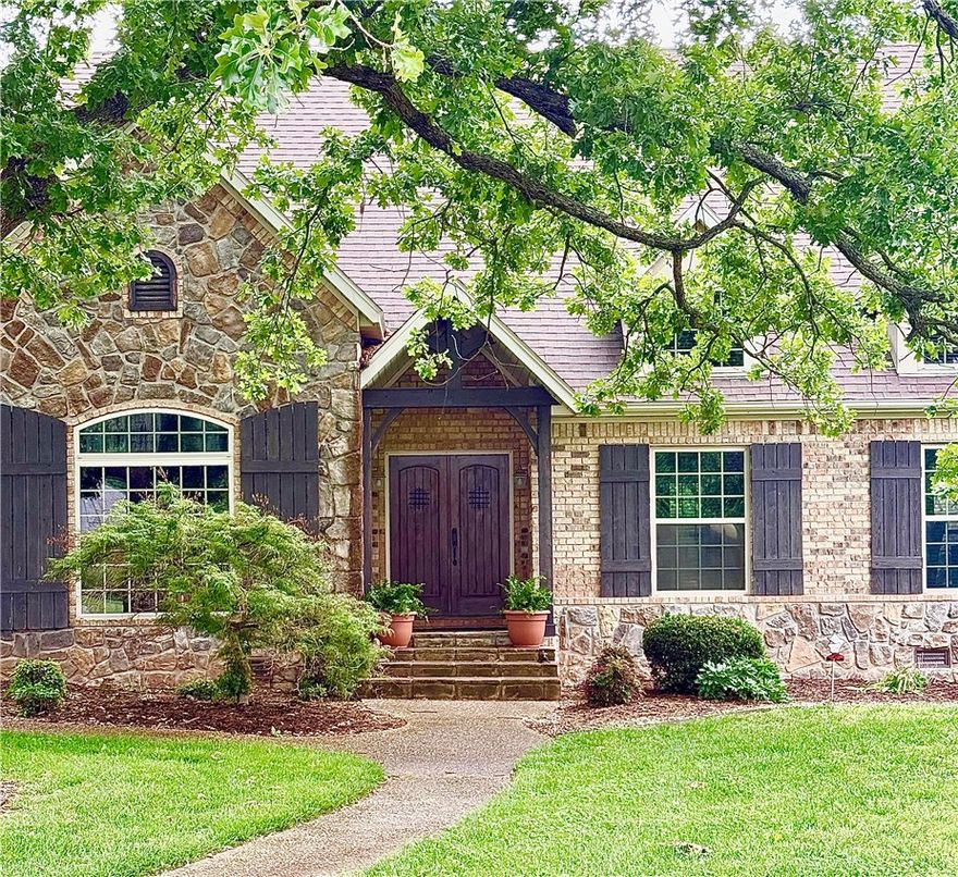 Storybook Cottage Estate! This European styled two story craftsman is nestled in prestigious Talamore on over 4 acres with wooded backlot ravine. Real Hardwood floors & furniture grade builtins/cabinetry. 1st Flr Primary Suite features a special extra room for mini office, craft corner, or closet. The Primary Bath features granite vanities, jetted tub, walkin shower, water closet,  and walkin closet. 2nd main level BdRm w/ensuite bath at side entry door- perfect for guests. Upstairs: 3rd BdRm w/ensuite bath & 4th BdRm set up as a Bonus Rm. Downstairs kitchen adjacent Formal Dining for festive holiday meals. Old World styled Gourmet Island Kitchen w/SS appliances; be sure to admire the grand gas range!  Perfect for entertaining, the Heart of this Home, the Two Story Formal Living Rm w/ Wet Bar, and central fireplace. Windows to back patio overlooks ornamental Koi fish pond. Generous 4-Car Garage. Lawn/Landscape sprinkler system. This remarkable estate provides a backdrop for grand lifestyle living; Welcome Home!