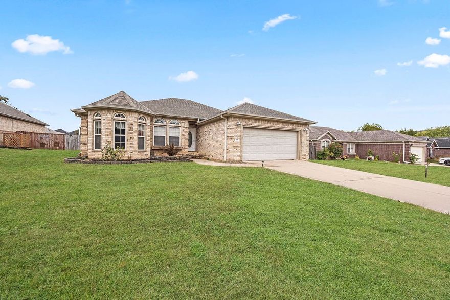 Adorable home in the Hidden Creek Subdivision! Impeccably maintained with ideal layout where functionality and style are at every turn. Wonderful layout flows seamlessly for practicality. Delightful eat-in kitchen boasts sleek stainless steel appliances and rich, warm butcher block countertops that provide ample workspace. Spacious bedrooms with split bedroom floorplan. Primary suite features double tray ceilings, cozy fireplace, walk-in closet, dual sink vanity with granite countertop, jacuzzi tub and separate shower. Custom pergola provides a shaded retreat, complete with adjustable louvers and optional screens for ultimate comfort. Private heated pool and firepit provide the perfect place to unwind with family and friends. Detached workshop has electric and ready to handle any project. Additional outbuildings for all your storage needs. Home is wired for 220 generator. Conveniently located close to schools and Riverside Park with trails and easy access to I-49 and 71-B. Come feel the charm this one has to offer!