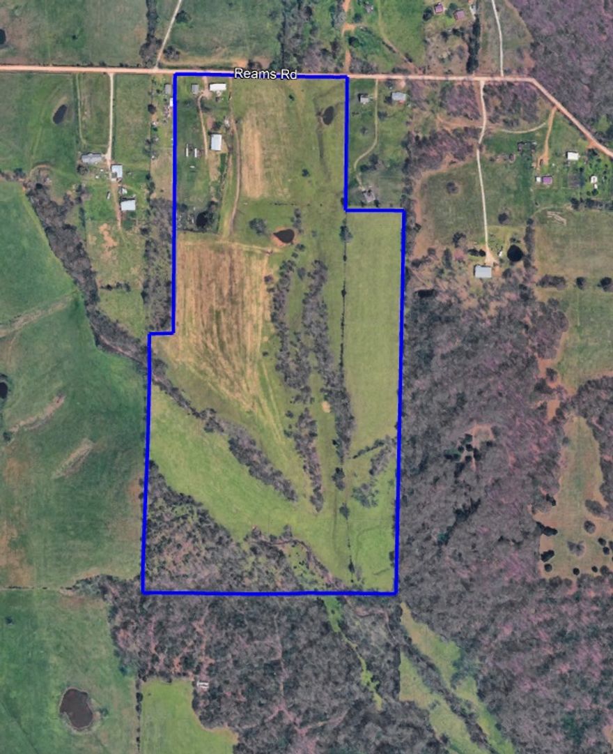 Prime 71-acre tract in a high-growth corridor, offering excellent potential for development or land banking. Level to gently rolling terrain provides multiple use options, including residential development, a private estate, or long-term investment. Conveniently located with close highway access. City water available and existing septic in place, with electric and propane on site. A 3-bedroom, 1.5-bath home sits on the property, making it move-in ready or ideal for immediate rental income. Two shops provide ample storage, and the property is wire-fenced, ready for farming or livestock. Enjoy the scenic setting with wide-open views and endless possibilities. Strong surrounding growth and increasing demand make this a strategic opportunity for investors, builders, or those seeking space with future upside.