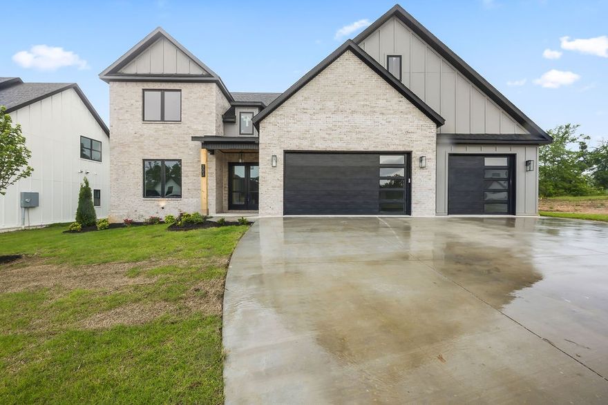 Next up in Autumn Hills, a lovely new home by Iron Gate Construction. Gourmet kitchen with commercial grade appliances including 60" fridge/freezer, gas range top, and double oven. Plenty of counter space, and walk-in pantry storage, coffee bar. 20ft soaring ceilings in the open great room. Master suite with dual vanity, tiled shower, and big soaker tub. Office on the main level along with a half bath. Upstairs are bedrooms two, three, and four plus two full bathrooms and a bonus room. Beautiful custom woodwork and iron details. Wired for sound and security. Three car garage, on-demand water heater, full yard sprinkler, covered back porch. 2 YEAR builder warranty. Truly a gem in West Bentonville, just 3.5 miles to the Square. Nearing completion, by the end of February. See floor plans in the photos.