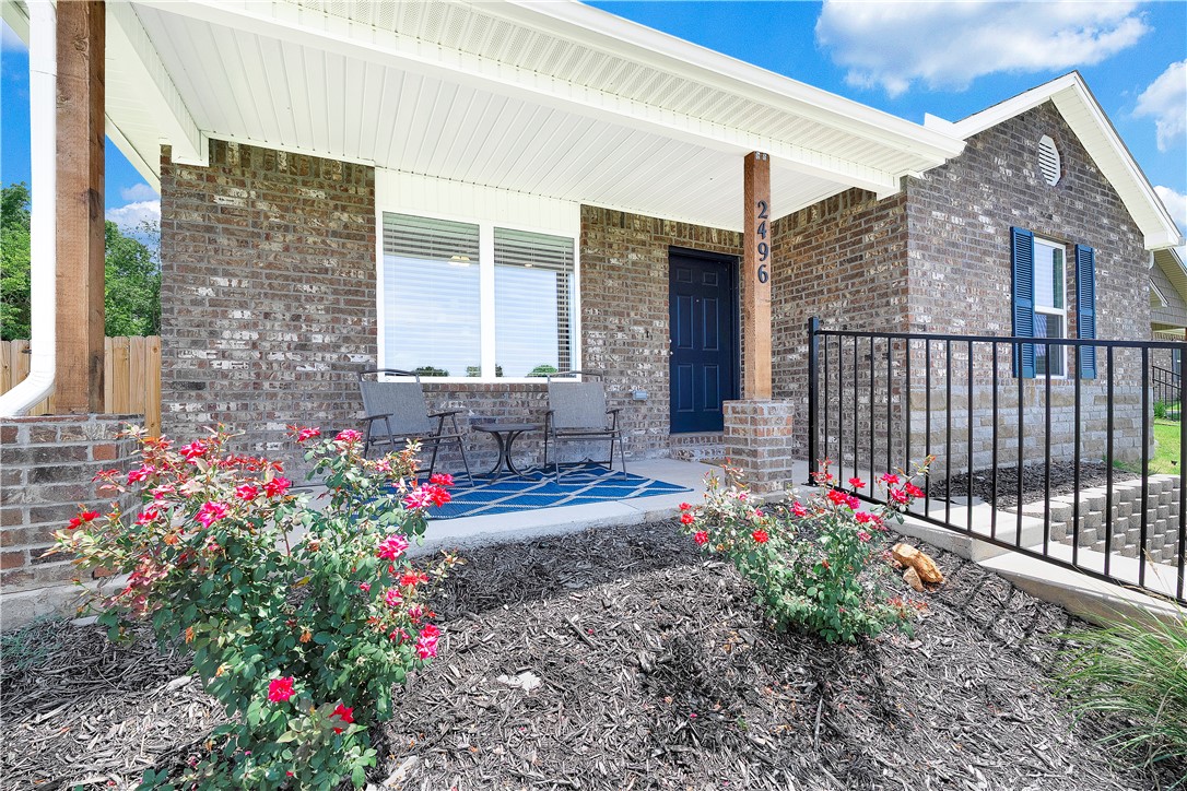 This gently lived in home is full of thoughtful upgrades and charm. You will love the granite countertops, white cabinets with hardware, and easy care vinyl flooring in the main areas. Extra lighting adds a bright and welcoming feel, and the open layout flows to an extended patio and spacious fenced yard perfect for relaxing or entertaining. The front yard is maintenance free with POA covering mowing. Tucked away on a quiet corner lot at the end of the street, this home backs to an open field for peaceful views and privacy. The larger yard and inviting front porch create the perfect spot to watch the sunset and enjoy the beauty of home. Approved borrowers will receive a closing cost credit of 1% of the loan amount up to $5,000 on their Closing Disclosure on their loan closing with Envoy Mortgage Branch NMLS #2659248 and Branch NMLS #2579798.