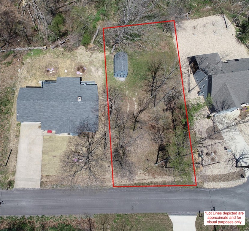 Incredible 0.33+/- acre lot in the Kirkwall Subdivision is ready for devloping your next new home! Primed and buildable, this lot boasts a level and cleared area, but still has mature trees sparingly on the property. Great location that is located within walking/biking distance to Loch Lomond and Tiree Park, perfect for fishing & boating. Easy access to Bella Vista Bypass and I49, with a quick commute to Walmart Home Office and the area's abundance of trails. Neighborhood showcases new construction and established homes throughout. Electric on-site and water is at the road. A 16Ć12 shed with loft to convey with the property. Come and see the location of your future home!