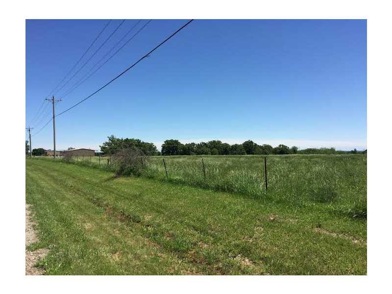 HUGE piece of land offers so much privacy while still being close to town. Two points of access to the road. Excellent development opportunity. Flat parcel with two highway access points. Could be used for almost anything. Very close to schools. 3458 sq,ft home on site with a barn.