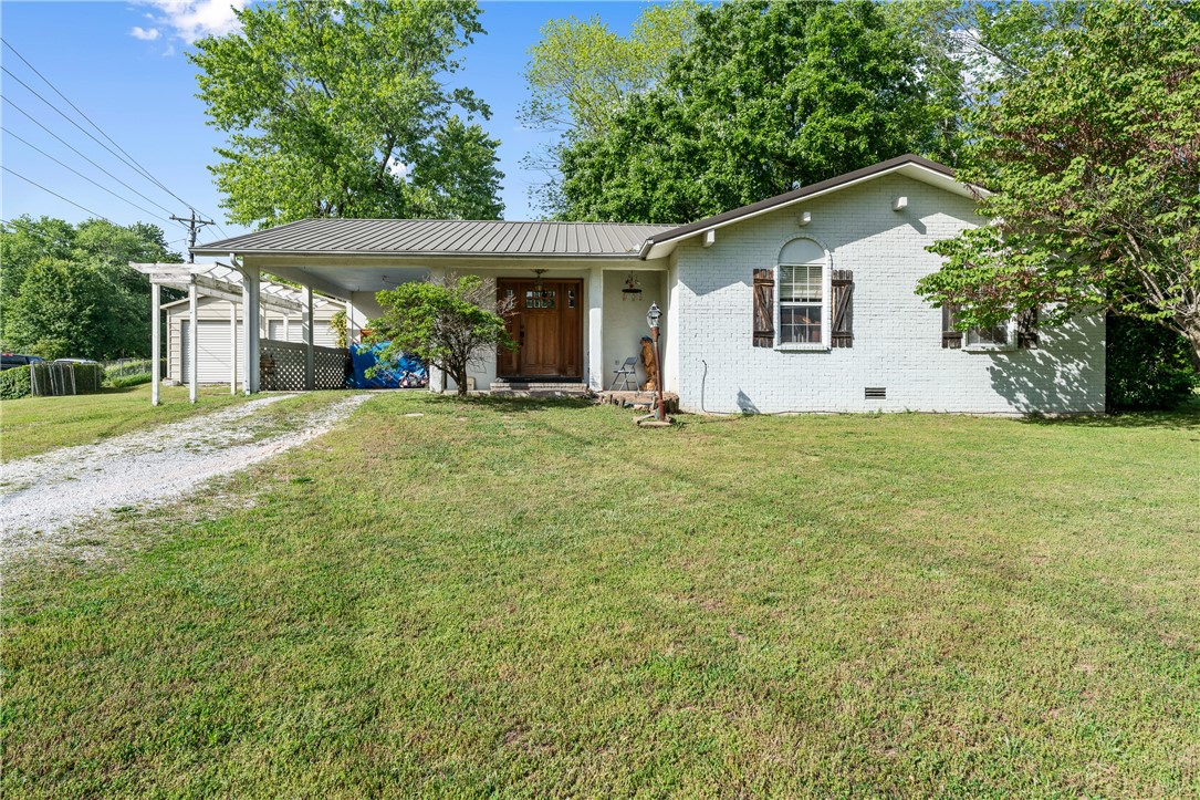 Welcome to this one-of-a-kind, custom-built home in one of Fayetteville’s most desirable neighborhoods.
Situated on a spacious 0.66-acre lot in the sought-after Vandergriff Elementary district, this property offers the charm of established living with room to make it your own. With only two owners, it has been lovingly cared for and holds incredible potential. The expansive lot invites possibilities for outdoor living, gardening, or future expansion. A detached two-car garage provides extra car storage or could serve as a great workshop. Additional outbuildings are ideal for hobbyists or those needing extra project space. Mature trees and a private patio create a peaceful outdoor retreat. While some updates could enhance the home, it presents a wonderful opportunity to personalize and add lasting value. Whether you're a first-time buyer or looking to downsize, this property combines location, space, and character.