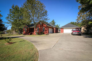You hear it all the time. LOCATION! LOCATION! LOCATION! Here it is! Just off Skyline, on Marina Way, sets this beautiful home on nearly an acre of open land. This home offers all that you're looking for. A fully plumbed shop? Yes! Large deck for entertaining? Yes! Separate den/office with a private fireplace? Yes! Brand new roof on the house, shop and shed. New HVAC in 2016. This home is one of the few on Marina Way not included in a subdivision.