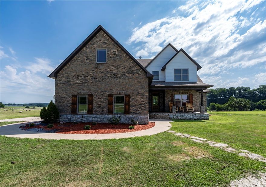 Welcome to this stunning 5 bedroom, 4 bath brick home on a picturesque 98 Acre property. Outside a covered back deck offers stunning views of the surrounding landscape, providing a peaceful place to enjoy the beauty of nature. A creek runs along the property providing a tranquil retreat. As you approach the home, you are greeted by a covered front porch inviting you in to explore all that this home has to offer. Inside is a spacious 2926 sq ft two-story home that was built in 2017, boasting a wood-burning fireplace & soaring ceilings in the living room. The main level features an office, primary bedroom/bathroom, & 2nd bed & full bath, providing convenient & comfortable living options. Upstairs, you'll find 3 additional bedrooms & 2 bathrooms, a large game/rec room offering entertainment & relaxation. The home also features a large laundry rm that connects to the primary closet. Convenience is key with a 2 car attached garage & a locker area for drop-off as you enter from the garage. Outbuildings & so much more.