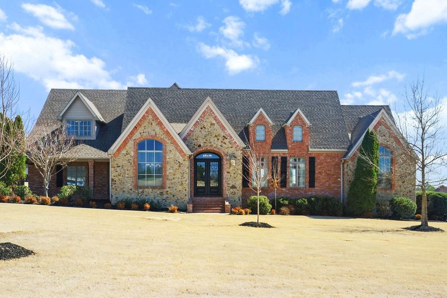 Located in Grand Valley Estates, this stunning 4,550 sq ft home, owned by a single family, sits on 2 acres near Sassafras Winery. The property borders a serene 4-acre neighborhood pond and green space. It boasts a 3-car garage, formal living and dining rooms, a wet bar, and two fireplaces—one wood-burning with gas assist and one with gas logs. Enjoy the expansive 900 sq ft cedar deck, along with 10- and 12-foot ceilings throughout. The home is equipped with high-end appliances, spray foam insulation, an alarm system, an automatic lawn sprinkler, and a brand-new composite roof installed in 2024. Upstairs, you'll find 3 bedrooms and 2 bathrooms, while the downstairs features 2 bedrooms and 2.5 bathrooms. Conveniently located just 5 minutes from the Fayetteville Athletic Club and 7 minutes from the Fayetteville Mall.