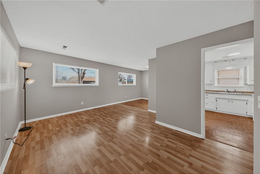 Move-In Ready 3-bedroom 1 bath house in the heart of Rogers.
All-New Professional Paint throughout the entire home. 3 bedrooms provide plenty of space for family, guests, or a dedicated home office. Turn-Key Living: Meticulously maintained and ready for immediate move-in. Attached Carport has built-in Storage.  The separate Workshop/Storage Building could be perfect for a workshop, hobby space, or heavy-duty tool storage.