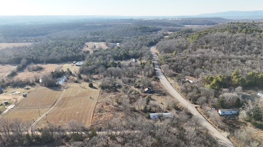 Beautiful 5.58 acres +/- in the Woodland area with county and private road access. The mobile home is inzero value, this listing is for lot value and the existing access to utilites. There is a conrecete floored barn with power and a well on the property as a bonus. Endless potential with beautiful views and ample room to build or place your new home. This is a highly desireable area and wont last long, call for your showing today!