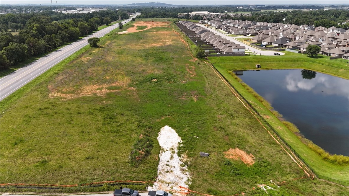 Wonderful opportunity to develop in this prime location just off of Pleasant Grove on the boarder of Rogers and Lowell in one of the fastest growing commercial areas. Located next to Fitness One with plenty of street frontage, utilities at the street, detention established to the west and ready for a multitude of possibilities. May also be purchased with lot 190 which would provide an additional 2.25 acres.