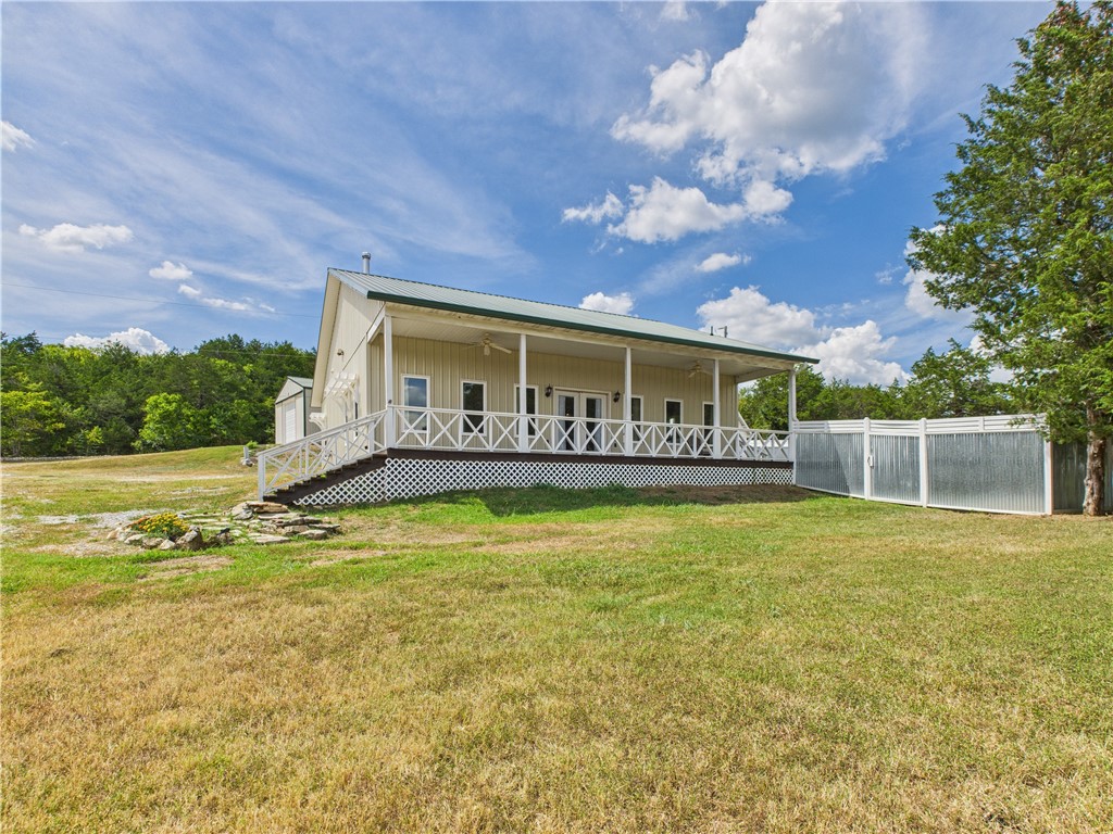 Family Retreat, Investment Property, or your Forever Lake Homestead! So much potential in this beautiful well maintained property. Located just 5 minutes form the campground and Marina. Along with the Main House the property has 4 full hookup RV. sights, one is covered. There is a 30 x 50 metal shop, to store the lake toys or would make an excellent work area. An out building for extra storage, newly constructed greenhouse, and a chicken coup, with enclosure and a pen. Several metal raised bed planters for an easy to tend vegetable garden or flowers. While the property is serviced by public water and sewer, there is also a water well on the property with a nostalgic cast iron handpump. All the unique attributes make this an amazing property that you must see to appreciate!