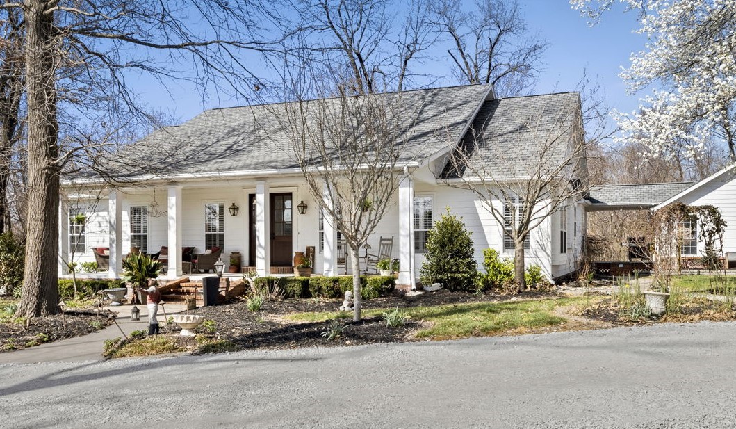 Homes like this don't come around very often! Come and see this beautiful Southern style home with an amazing front porch where you could spend hours. Drive up the tree-lined asphalt driveway and enjoy your 14.89 acre slice of heaven! Beautiful high-end newer roof/gutters, siding, and garage doors on both the home and additional detached garage! Eat in kitchen with tons of counter space, and a Formal Dining room that could be used as a 2nd living area. Beautiful newer front doors, original wood floors and 3 full bathrooms are just a few of the features you will love. Enjoy the sunshine, murphy bed, & the wood burning stove in the sunroom. The detached garage could be an amazing place to finish out for an additional living quarters, or to park your toys/do your projects! Asphalt recently sealed and new gravel brought in. AC/Furnace 2018. This home & land are ready for you to enjoy the peaceful sounds of nature or make some new trails through the woods for your ATV's or bikes! Refrigerator, washer, & dryer convey.