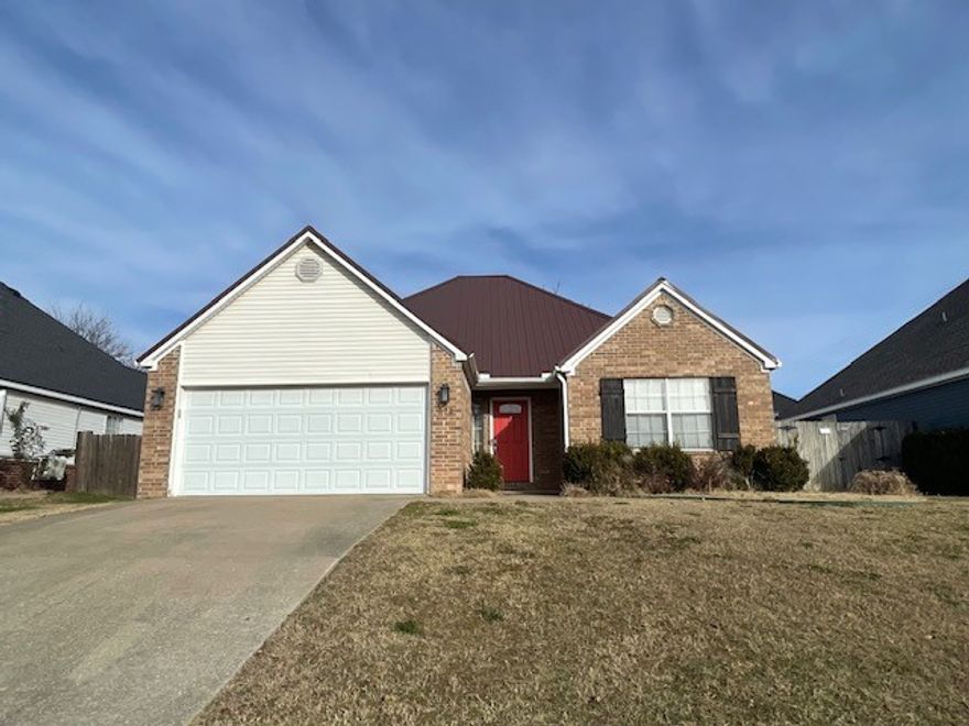 3-bedroom, 2-bath home with a split floor plan. The living room features a fireplace. The primary bedroom includes a walk-in closet, and the primary bathroom offers a double vanity. Enjoy a fenced backyard with a patio for outdoor living.**$250 non-refundable pet fee per pet**