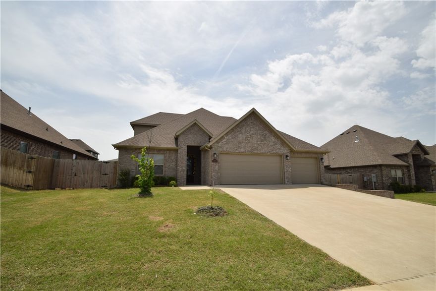 This Bentonville home offers a fantastic location with easy access to trails and community amenities. Bike trails to Osage & Creekside Parks are across the street, while the neighborhood features a pool and playground. A short drive to the Activity Center, and 15 mins to Walmart & I-49, it blends recreation and convenience. Located in the Bentonville school district, it sits on a corner lot with a privacy-fenced backyard and covered patio. Inside, 4 beds and 3 baths feature wood floors, tall beamed ceilings, and a fireplace. The open floor plan includes a kitchen with gas cooktop, granite counters, pantry, eat-at bar, and dining space. The primary suite has beamed ceilings, a walk-in closet, shower, tub, and double vanity. A 2nd bed and bath are on the main floor. Upstairs, two additional bedrooms, full bath, and a landing area perfect for a desk. Refrigerator, washer, and dryer included. Pet negotiable with owner approval. No Smoking.