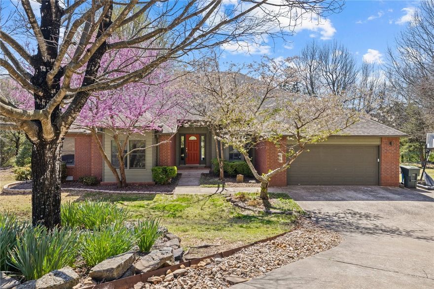 Experience the charm of this secluded home with many updates on Mt. Sequoyah! Beautiful wood floors adorn the main level, complemented by a grand cathedral ceiling that opens onto a covered 29'x20' deck boasting stunning southern views. The kitchen features an island, granite countertops, and a cozy eat-in area. All bedrooms are conveniently located on the main level, with the primary bedroom featuring its own fireplace and a luxurious spa-like bathroom. The walk-out basement offers additional living space, including a kitchenette, living area, exercise room/bonus space, game room or potential 5th bedroom, full bath, and screened-in sunroom, making it ideal for entertaining by the gunite in-ground heated pool. Find your ideal hideaway on Mt. Sequoyah, where comfort and style harmonize seamlessly throughout.