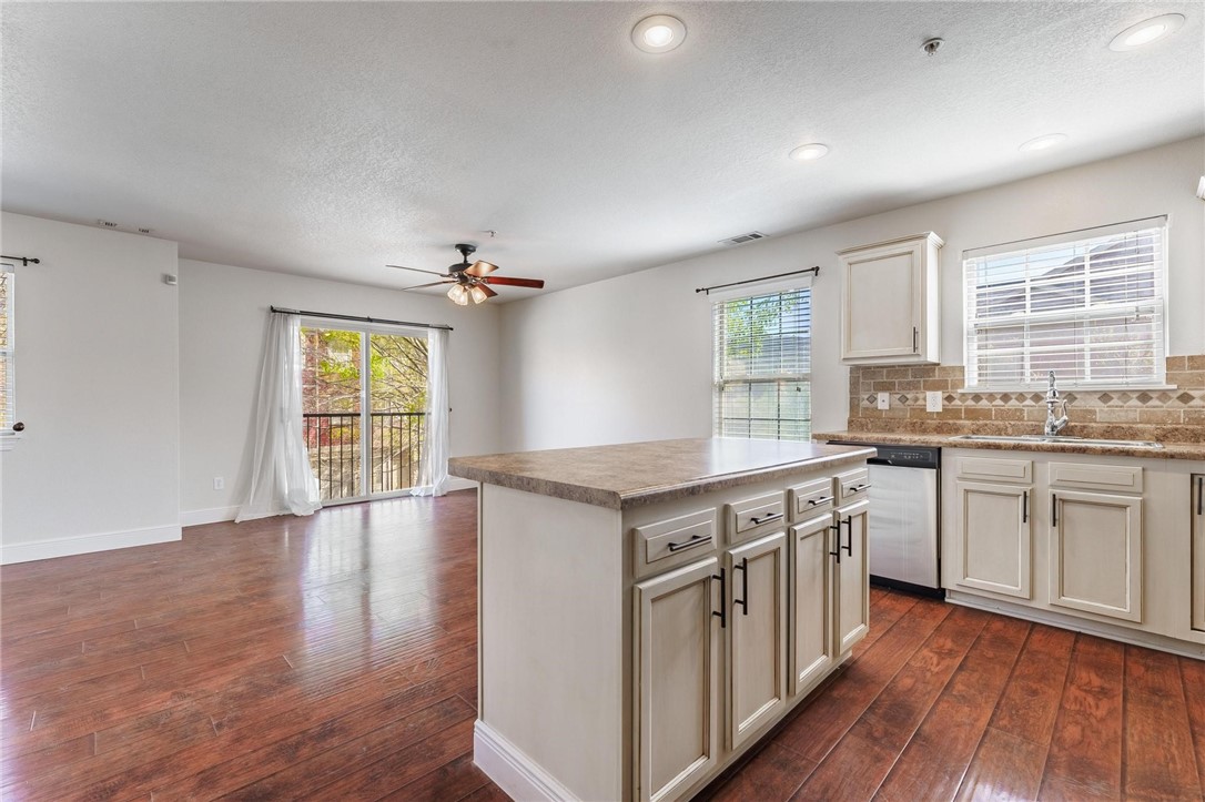 Fantastic opportunity to own this 3-story, 2-bed, 2.5-bath condo in prime Fayetteville location! Just minutes from the University of Arkansas and with easy access to I-49, this home is perfect for a student or anyone wanting easy access to local amenities. Ideally situated off I49 and a mere 2-mile drive lands you at the University of Arkansas, while the Fayetteville Traverse Trail, just steps away, also links you to the UA Campus, Centennial Park, Kessler Mountain Regional Park, and more. The 1st floor has a 2-car garage, while the 2nd floor hosts a cozy living room, half bath, and kitchen with a large island and dining area. The 3rd floor offers two bedrooms/two full baths and laundry. Fresh interior paint throughout. Monthly POA fees cover all exterior building maintenance (including roof) and lawn care. Refrigerator and Washer/Dryer Set included.
