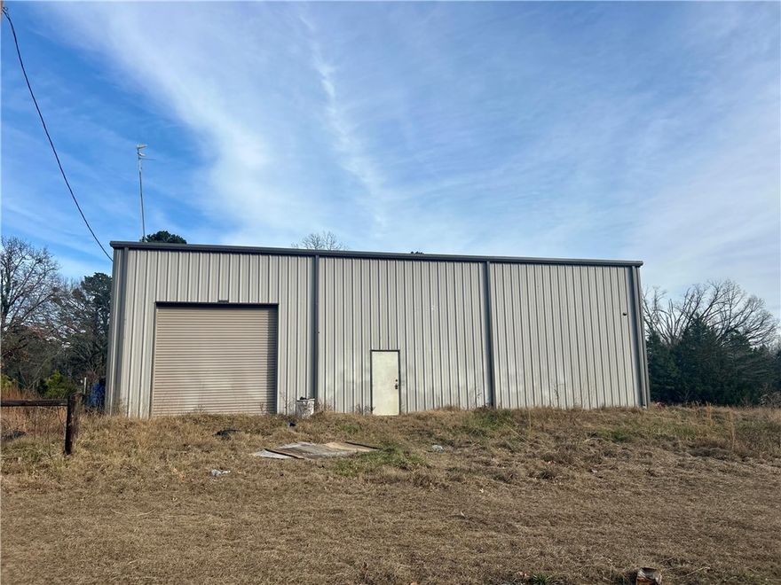 Discover the possibilities with this 40x60 shop building situated on 8 beautiful acres, partially cleared and partially wooded offering the perfect blend of open space and privacy. The shop is equipped with electric, making it ideal for immediate use or future expansion. Whether you're dreaming of building your custom home, creating a shophouse or barn dominium, or needing a spacious workshop or storage area, this property offers endless potential. Enjoy the peaceful country setting while still having room to grow, explore, and design a space that fits your lifestyle. A rare opportunity to own acreage with improvements already in place-bring your vision and make it your own!