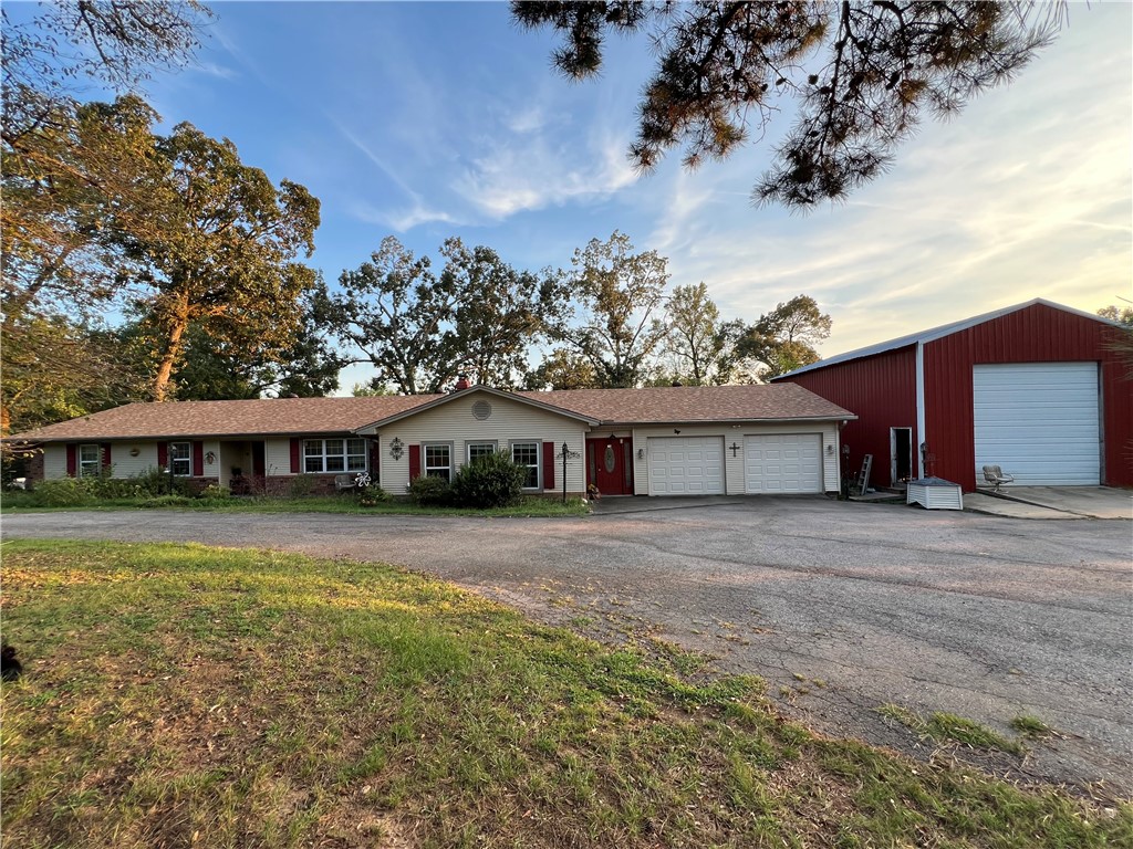 This one checks all the boxes! Nice updated home on over 6 acres. Smiley Creek runs through the acrage. Nebo State Park is right up the road offering great hiking and mountain bike trails. 25 X 40 shop with camper sized overhead door, large back deck and beautiflu landscaping with lots of flowers. The updates include new roof, doors, garage doors and opener, granite counter tops and backsplash, complete updating on both bathrooms, and so much more. At $299,700 This one will be gone in 2 shakes of a goats tail.