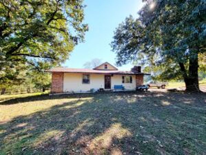 11 Acres outside of Dardanelle. 4-bedroom, 3 bathroom, 2 living areas, shop and additional small home.