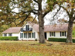 Lake Atkins is less than 1/2 mile away, and if that's not enough convenient enough, just walk out your back door and enjoy the privacy of the shared lake. Nestled with the private lake and paved county roads to the west and south, you have the feel of being miles out in the country, but in fact, you are 2 miles from highway 64 between Pottsville and Atkins. Recently renovated with new flooring, including tile in kitchen and bathrooms. Upstairs loft room perfect for office or 4th bedroom.