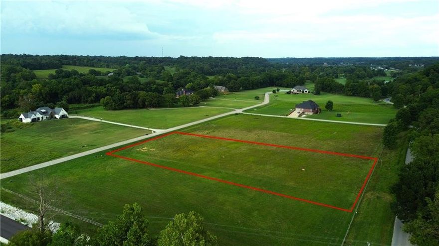 Discover the perfect blend of country charm and modern convenience on this 2-acre level lot in Creekside Estates. Enjoy a peaceful rural setting just minutes from Hwy 612 and I-49, with Shaw Family Park only 10 minutes away and XNA Airport within a 15-minute drive. Ideal for golf enthusiasts, Creekside Golf Course is nearby, and horse lovers are welcome. With utilities at the street, it's the ideal spot to build your dream home.