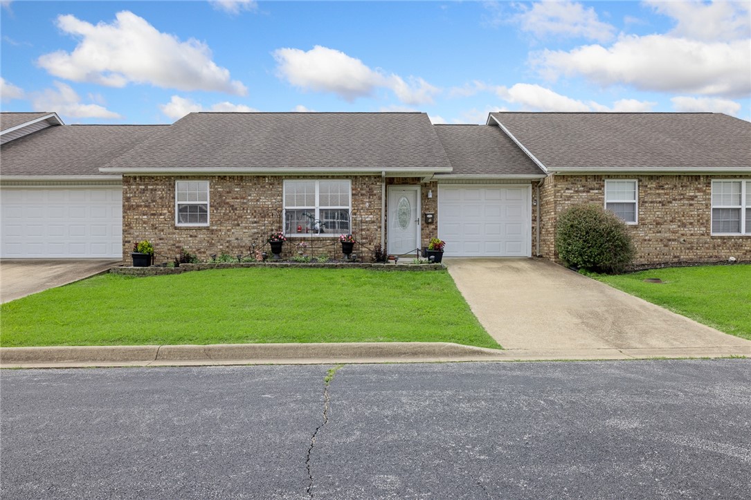 Welcome to a well-maintained condo in a quiet 12-unit complex in Harrison, AR. Built in 2004, this 1,204 sqft home offers low-maintenance living. A spacious 3-bed, 2-bath is designed for comfort & convenience. The primary bathroom includes a walk-in shower, & the 2nd features a tub/shower combo. The living room flows to a kitchen with abundant cabinet storage. All GE appliances stay, range, microwave, refrigerator (water & ice) & dishwasher. The counter with double sink, modern faucet & disposal separates the kitchen & dining area. Joining the dining area is a utility closet with folding doors, housing a washer, dryer, & shelf. Easy upkeep with dual-pane tilt windows. WiFi door lock with 6 way entry. Outside, there's an expansive 10' x 20' deck for enjoyment with solar post lamps & solar security camera. An attached single-car garage with built-in 2ā x 8ā shelving, 2 garage door openers, additional guest parking at the west end, $80/month POA dues covers exterior maintenance, lawn care & annual termite inspection.