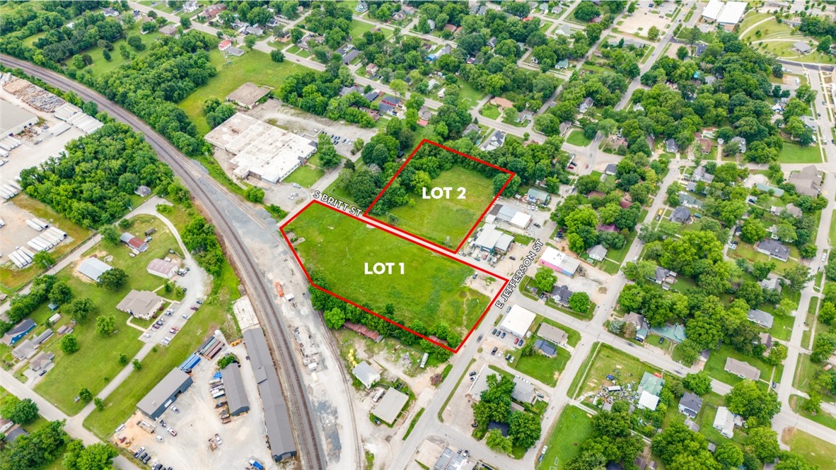 Two lots ready for development within an industrial corridor of Siloam Springs. Property has access to major highways, the Arkansas-Missouri railroad, and Oklahoma. Seamlessly improve your distribution and manufacturing needs in this rapidly growing area of Northwest Arkansas.
Lots may be purchased individually or as a package.
Approved flex warehouse plans available to transfer with sale.
Lot 1 features direct Arkansas-Missouri Railroad access.
Flat, cleared, and ready for development.
Versatile zoning allowing for multiple uses.
Centrally located in town, & minutes from Hwy 412 & Oklahoma.