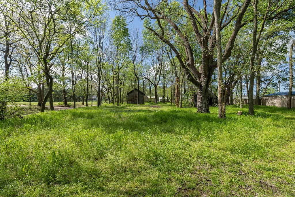 Beautiful partially wooded 1/2 acre MOL lot at the end of a dead end private road in Hindsville. The old buildings tell the story of a town that once was; Whitener. The rock house next door used to be the town doctors office and a neighboring property has a spring that provided the town water. All the buildings on the property are original to the old town. Easy access to Fayetteville, Springdale or Huntsville. Beautiful country setting just 1/4 mile off black top. Large mature shade trees and fairly level ground would make a great place for a custom home. Don’t wait, call today!