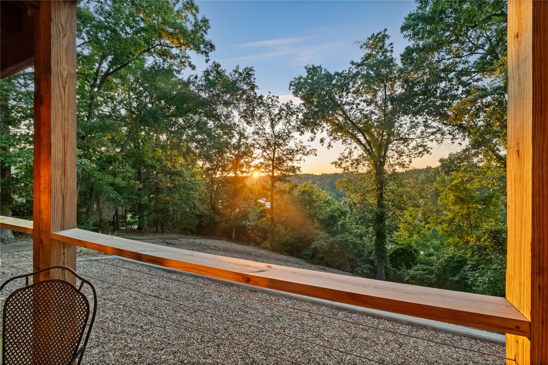 Take in stunning lake views every day from this 4-bedroom, 3.5-bath home perched above scenic Lake Ann. Built in 2001, this well-maintained property offers a spacious walk-out basement with a wet bar, abundant storage, and a dedicated workshop—perfect for outdoor gear or hobbies. Recent updates include a new roof and HVAC system, giving you added peace of mind. The backyard has been thoughtfully enhanced for low-maintenance enjoyment. Just minutes from the Back 40 mountain bike trails and Summit School, this is the ideal home base for outdoor enthusiasts who want the best of Bella Vista living with tranquil water views.
