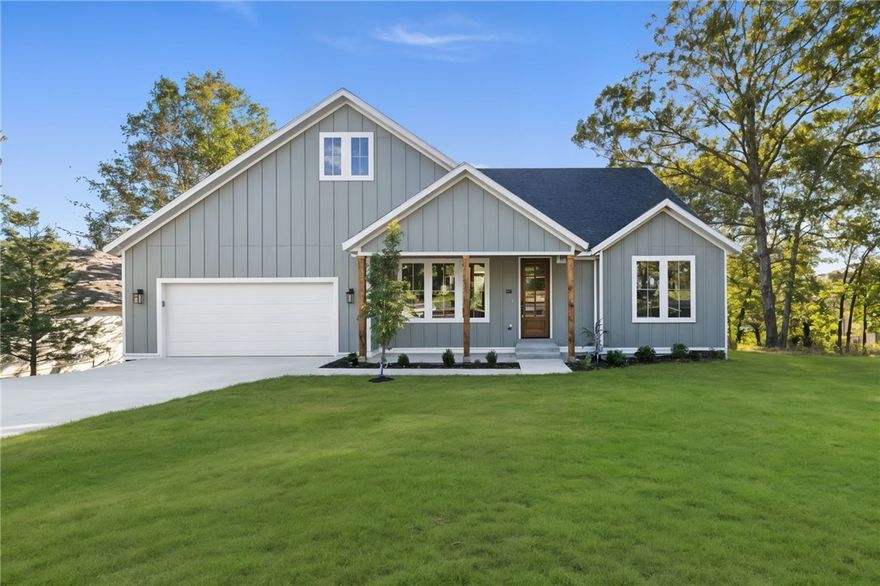 Welcome to 31 Cullen Hills Drive—a stunning 3-bedroom + office, 2-bath home in the heart of Bella Vista, AR! This beautifully crafted home features a show-stopping waterfall island, oak hardwood floors throughout, and custom soft-close cabinetry in every room. Custom lighting and designer tilework add a touch of luxury to every corner. The dedicated office offers a perfect space to work from home or pursue hobbies. Enjoy access to world-class amenities: miles of scenic bike and hiking trails, 7 private lakes for fishing and boating, golf courses, rec centers, pools, tennis courts, and more—all nestled in the natural beauty of Northwest Arkansas. Located just minutes from Bentonville’s thriving arts and culinary scenes, this home blends serene living with modern convenience. Whether you're into mountain biking, kayaking, or simply relaxing in nature, Bella Vista offers the lifestyle you've been looking for. Don’t miss this move-in ready gem!