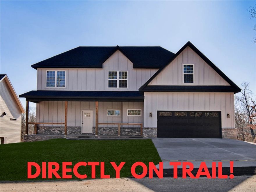 MOVE-IN ready new construction with a bonus room on a wooded lot directly on the bike trail! Bentonville schools! This stunning property offers the perfect blend of nature and nearby amenities. Conveniently located a few minutes to Lake Ann and close to the Back 40 Trailhead. Step inside to discover wood floors, a beautiful fireplace, custom cabinets, and elegant 3 cm quartz countertops. The expansive kitchen and gas range is perfect for culinary creations. This thoughtfully designed home features 3 spacious bedrooms plus a versatile bonus room, providing ample space for entertainment. The primary bedroom is conveniently located on the main level. Also listed for sale ML# 1329796