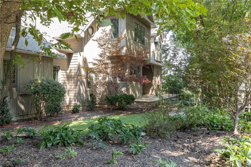 Exquisite custom built contemporary craftsman home on Mt. Sequoyah. This 1-owner cedar sided home, was built with the utmost attention to detail. The living room with a cathedral ceiling is trimmed with cherry, gas fireplace and plantation shutters. A huge butcher block island anchors the kitchen, with granite, gas range, cherry cabinets and double oven as a true chef's workspace. The primary suite features a cathedral ceiling & beams & private screened-in porch for peaceful tea time and a book. The den and living room have gas fireplaces. Well trimmed bathroom with dual vanity, makeup station, soaker tub and large closets. Upstairs, you will find two bedrooms with vaulted ceilings, beams and a private balcony. Downstairs has a flex room (no window) with a private bathroom. Custom surround sound throughout. Stunning landscaping with tree canopy, native stone work and an incredible water feature. Irrigation on separate meter. Large front porch and deck off back. Tandem 3-car garage/workspace. Whole house generator.