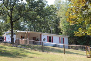 Charming cottage with your very own private boat dock!! This home makes a perfect retreat for anyone who wants the quiet of nature but not too far from town. Includes a nice large shop and 2 car garage on 1.50 +/- acres. Don't miss out on this unique home, schedule your showing today.