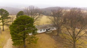 Beautiful setting in the country! This 3 bed, 3 bath home is situated just outside Alpena on 4.86 beautiful acres. Home features central air conditioning and propane central heat, but also has a wood stove in the entryway if you prefer wood heat, plus you can install ventless gas logs in the fireplace in the living room. The 3rd bath and optional 4th bedroom are just off the garage. Large living room and kitchen.