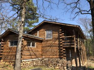 Living the dream with this fully furnished Log cabin home! Scenic mountain views, near the beautiful Ouachita National Forest, Blue Mountain Lake (less than a mile away), A must see home that welcomes you with a large open star gazing deck, 2 covered porches, that lead you into this relaxing retreat. Log beams on ceilings, wood & ceramic tile floors,ceiling fans, wood burning stove, and windows throughout.Garage and workshop, horse pasture, Public Water, High speed Fiber Optic Internet available. Area activity seem endless here, hiking trails,hunting, biking,boating,fishing, camping,4 wheeling.