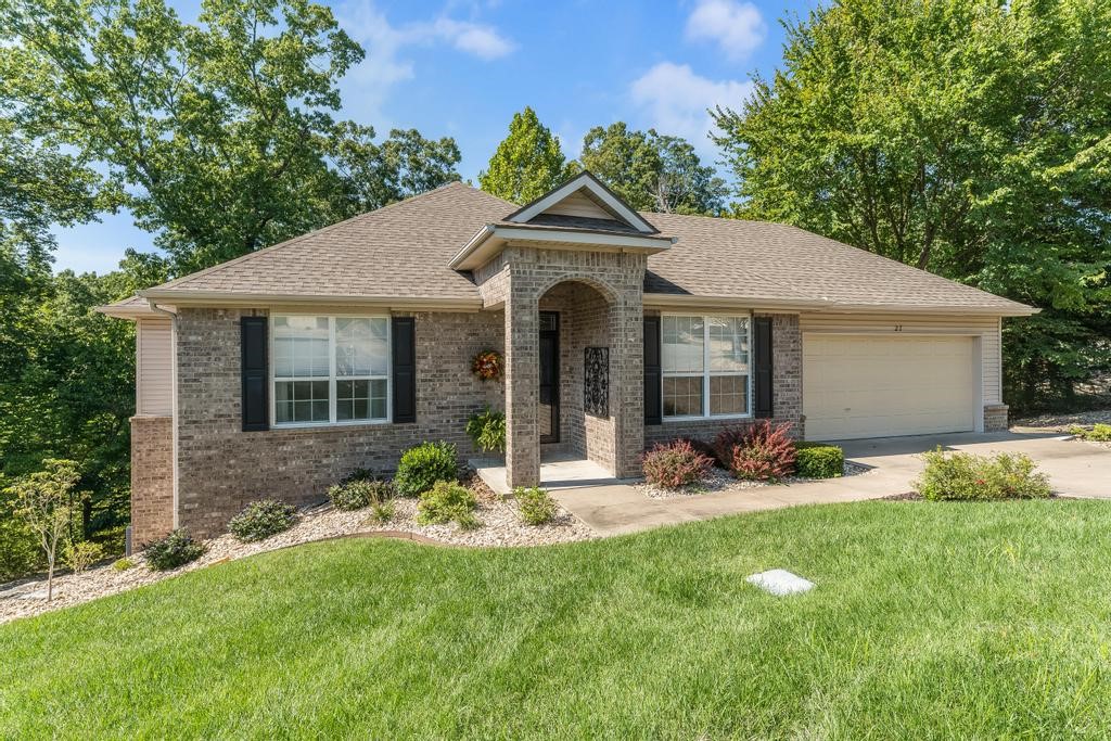 Welcome to easy living in the desirable 55+ Highland Park Villas of Bella Vista! This beautifully maintained Cooper-built Brighton floorplan features 2 spacious bedrooms, a versatile study, and a smart split layout for added privacy. Enjoy cozy evenings by the gas fireplace with remote-controlled heat, and appreciate thoughtful touches like natural wood floors, newer Corian kitchen countertops, roll-out pantry drawers, and an updated guest bath with a tiled walk-in shower. The 2-car garage offers abundant storage, plus a concrete walkway leading to a storage room under the home. You'll love the low-maintenance lifestyleāyour monthly condo fee covers lawn care, landscaping, yearly gutter cleaning, and access to a private clubhouse with pool, fitness center, walking trails, and Lending Library. Discover comfort, convenience, and community in the heart of Bella Vistaāperfect for your active, worry-free life!