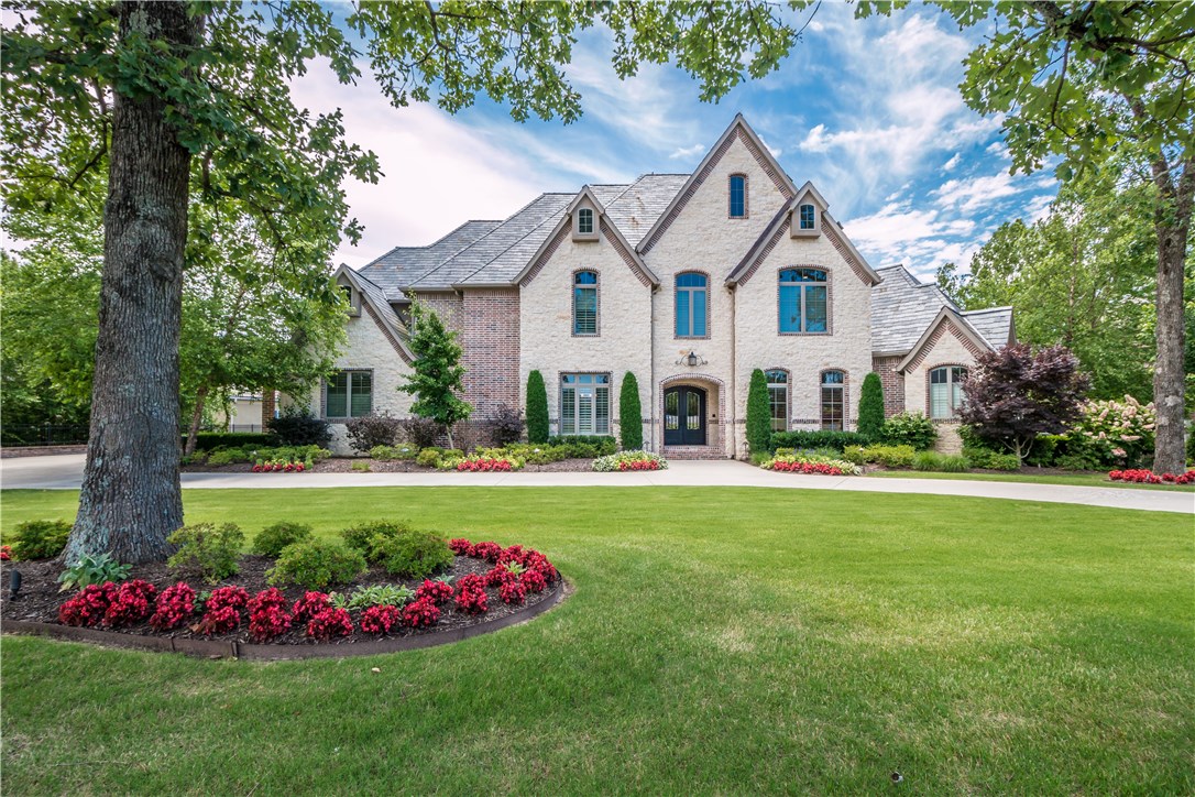 Stunning golf front estate located in the prestigious Pinnacle Country Club! This immaculate custom built home offers 5 bedrooms and an inviting open floor plan with thoughtful design and layout. Exceptional features including curved staircase, wine room, floor to ceiling windows, 4 living areas, 3 fireplaces and a gourmet kitchen with 2 islands! The lower level boast a recreation room, kitchen, media room, exercise room, lower garage/storage and an additional en suite guest room. Entertain or relax on the generous .81 lot offering lush landscaping, spacious deck & patios, sport court and enjoy the exquisite views of the golf course