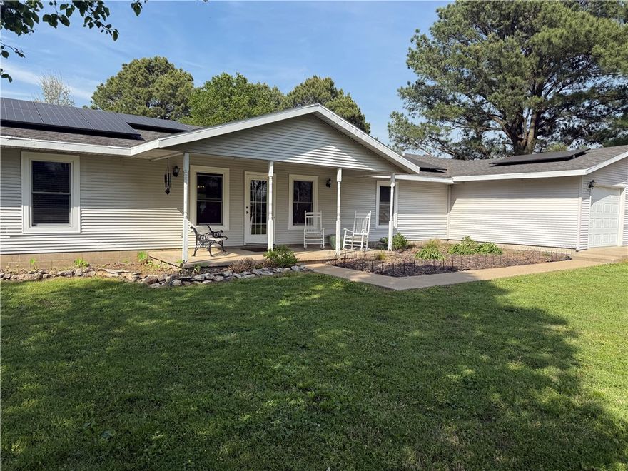 Do you want to live in Northwest Arkansas and within 40 minutes of the Walmart Home Office? Here's your chance! Oh you want acreage and space for a garden and a pony? Yep! This still works! You want solar power? Yes! $40 a month average. Public water? Yes! Well water for vegetables and the pony? Yes. Bonus room/family/game room? Yes. Beautiful pine trees? Yes again. If there is something you want or imagine for an active family or a quiet space away you can have it or can make it so. Home has new windows just last year (and they are beautiful) and recent water heaters and solar array will be paid off at closing. You'll want to see this place and this peace.