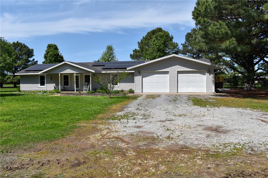 Do you want to live in Northwest Arkansas and within 40 minutes of the Walmart Home Office? Here's your chance! Oh you want acreage and space for a garden and a pony? Yep! This still works! You want solar power? Yes! $40 a month average. Public water? Yes! Well water for vegetables and the pony? Yes. Bonus room/family/game room? Yes. Beautiful pine trees? Yes again. If there is something you want or imagine for an active family or a quiet space away you can have it or can make it so. Home has new windows just last year (and they are beautiful) and recent water heaters and solar array will be paid off at closing. You'll want to see this place and this peace.